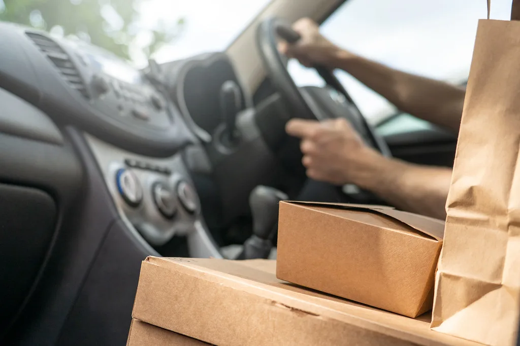 Food delivery driver delivering online order. US Ghost Kitchen Delivery Insurance Requirements: Checklist